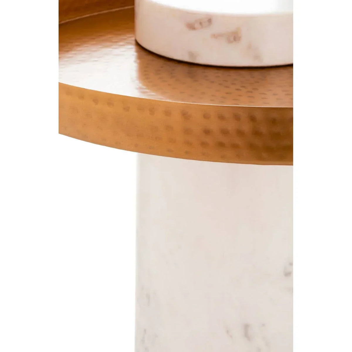 Hammered gold side table with white marble base closeup