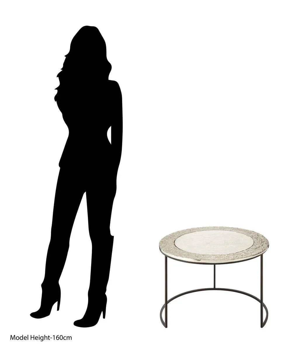 Round stone coffee table with metal frame beside 160cm silhouette for scale