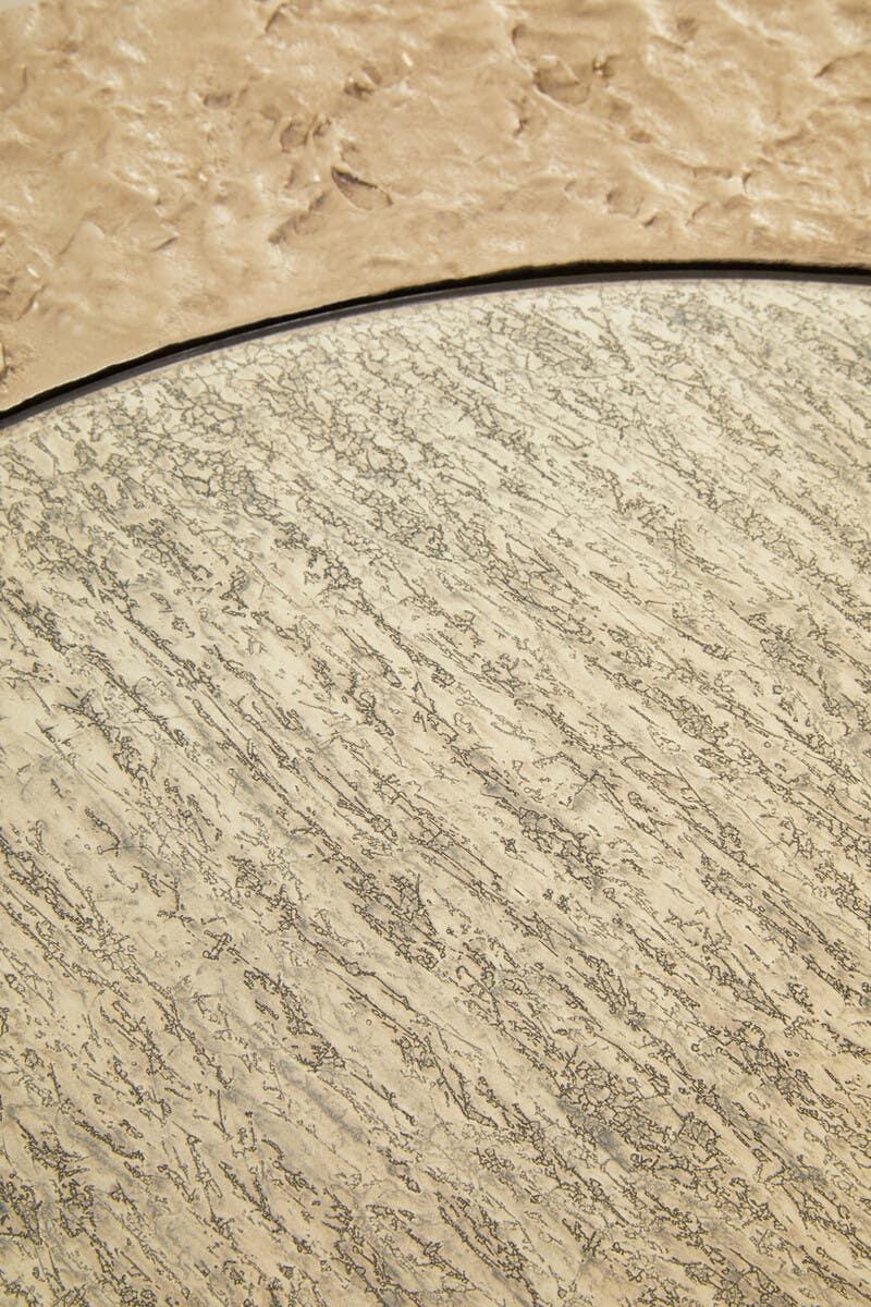 Beige textured tabletop with marbled and grain patterns, close-up surface detail