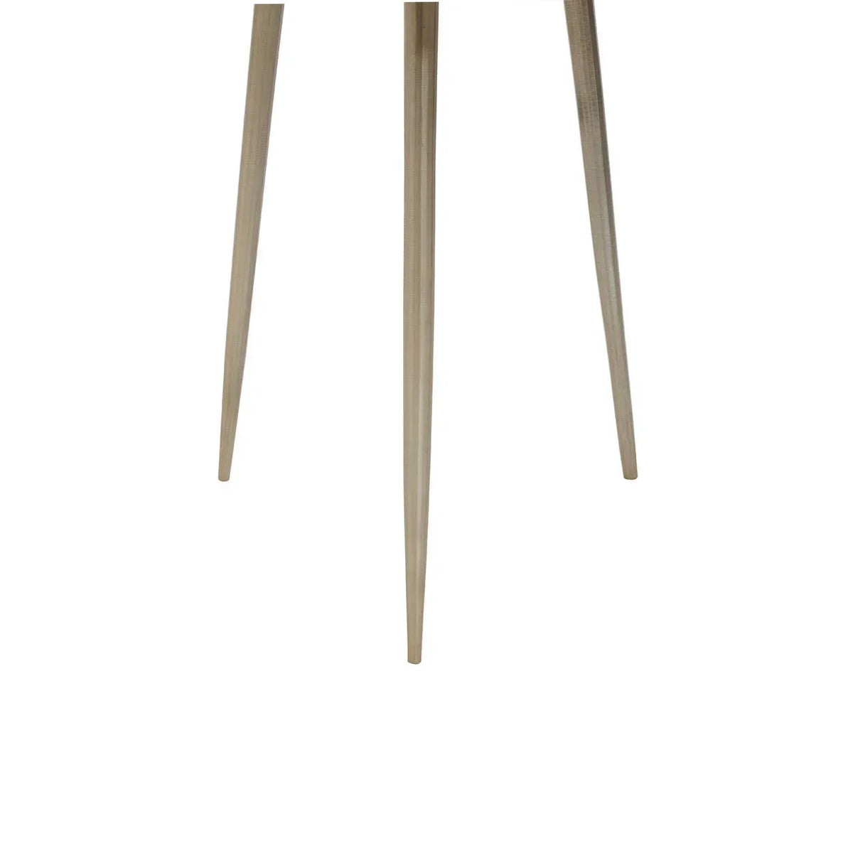 Tapered metal furniture legs in brushed gold finish close-up view