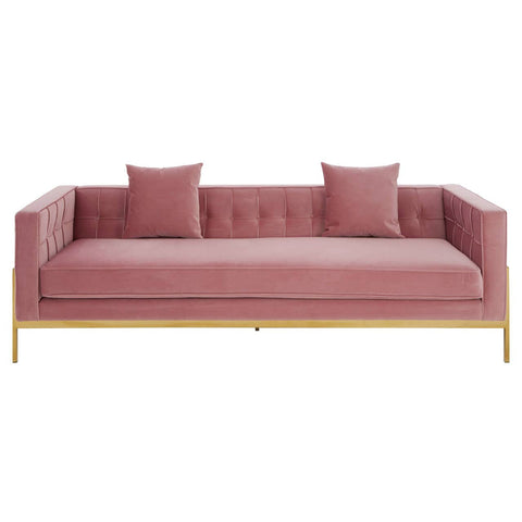Three-seat pink sofa with a tufted backrest, two matching cushions, and sleek gold legs. The fabric has a soft texture, and the overall design is modern and minimalist