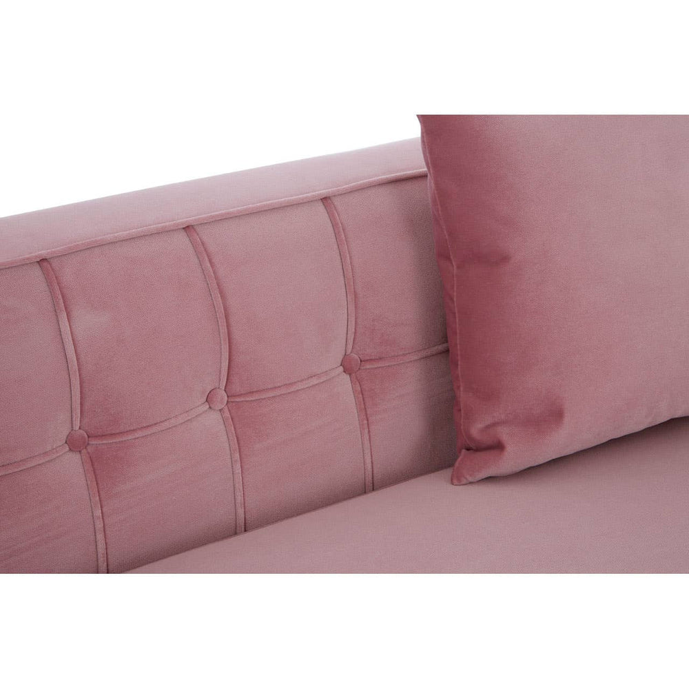 Soft pink fabric sofa with a tufted backrest and a matching cushion, showcasing a modern design suitable for home decor