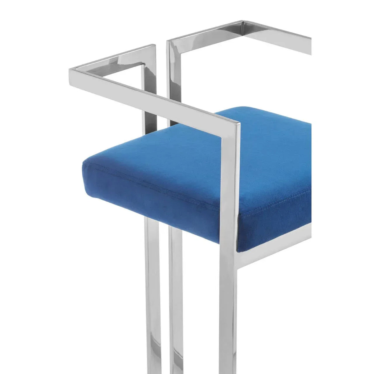 Chrome frame dining chair with blue velvet seat and modern armrest detail