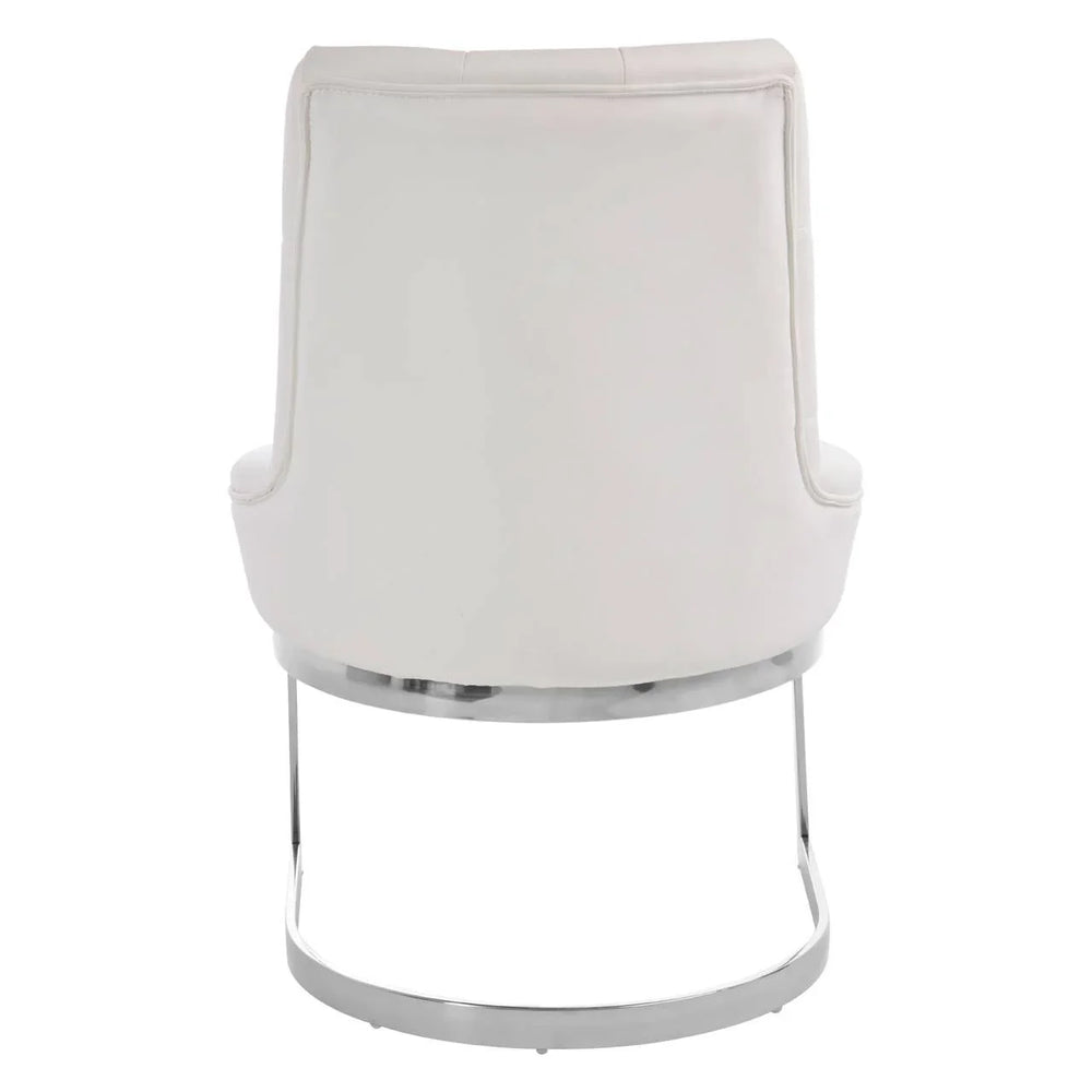 Rear view of white upholstered dining chair with chrome metal base