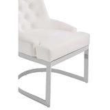 White upholstered dining chair with chrome metal legs and tufted backrest, angled side view