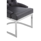 Black faux leather dining chair with chrome metal legs close-up