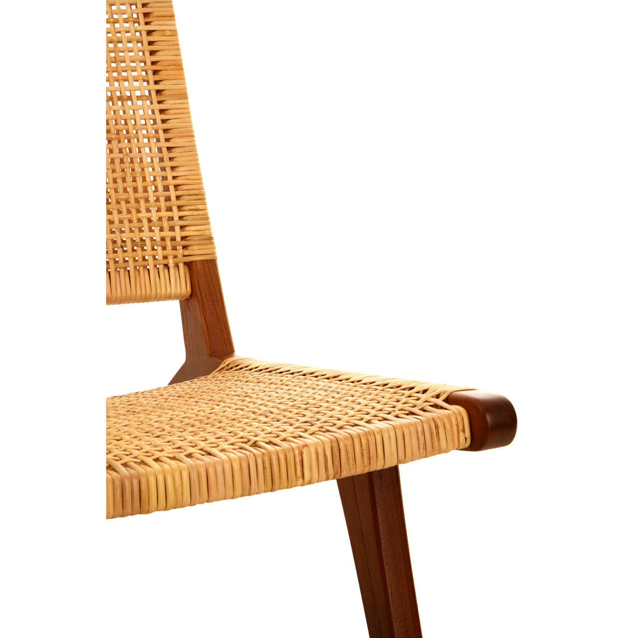 A close-up view of the Lovina Wood and Natural Rattan Lounge Chair, showcasing its woven rattan seat and backrest, supported by a sturdy wooden frame with angled legs. The natural tones of the rattan and wood create a warm, inviting aesthetic