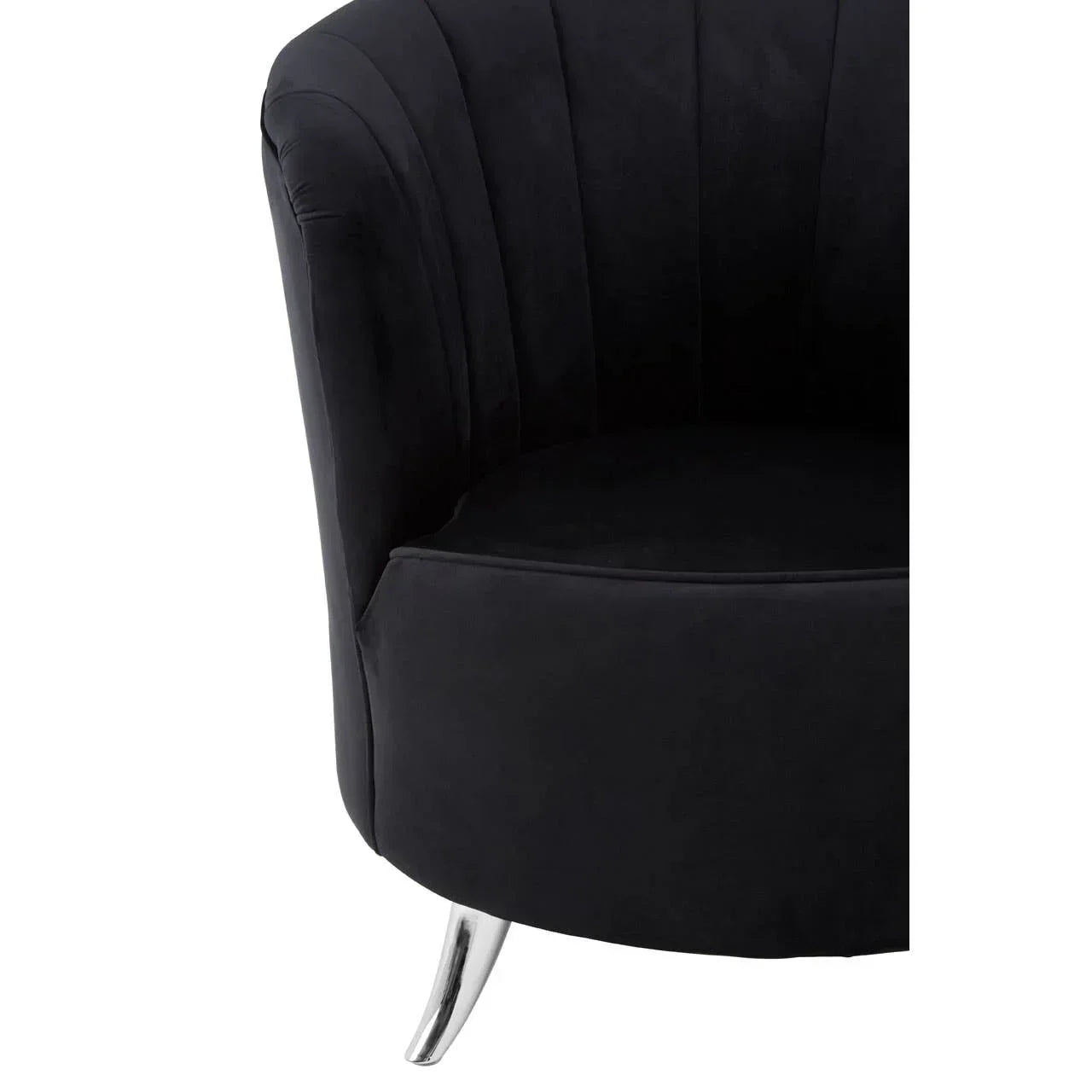 Black velvet accent chair with chrome leg, close-up of curved arm and scallop detail