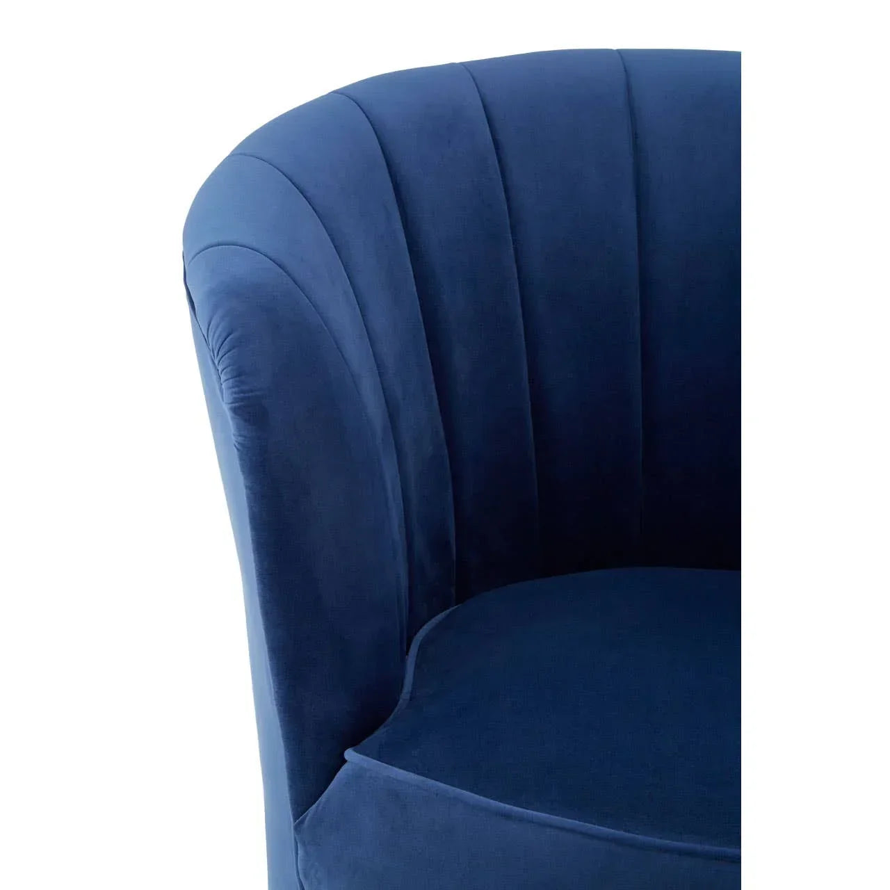 Blue velvet accent chair with curved backrest and vertical channel stitching detail