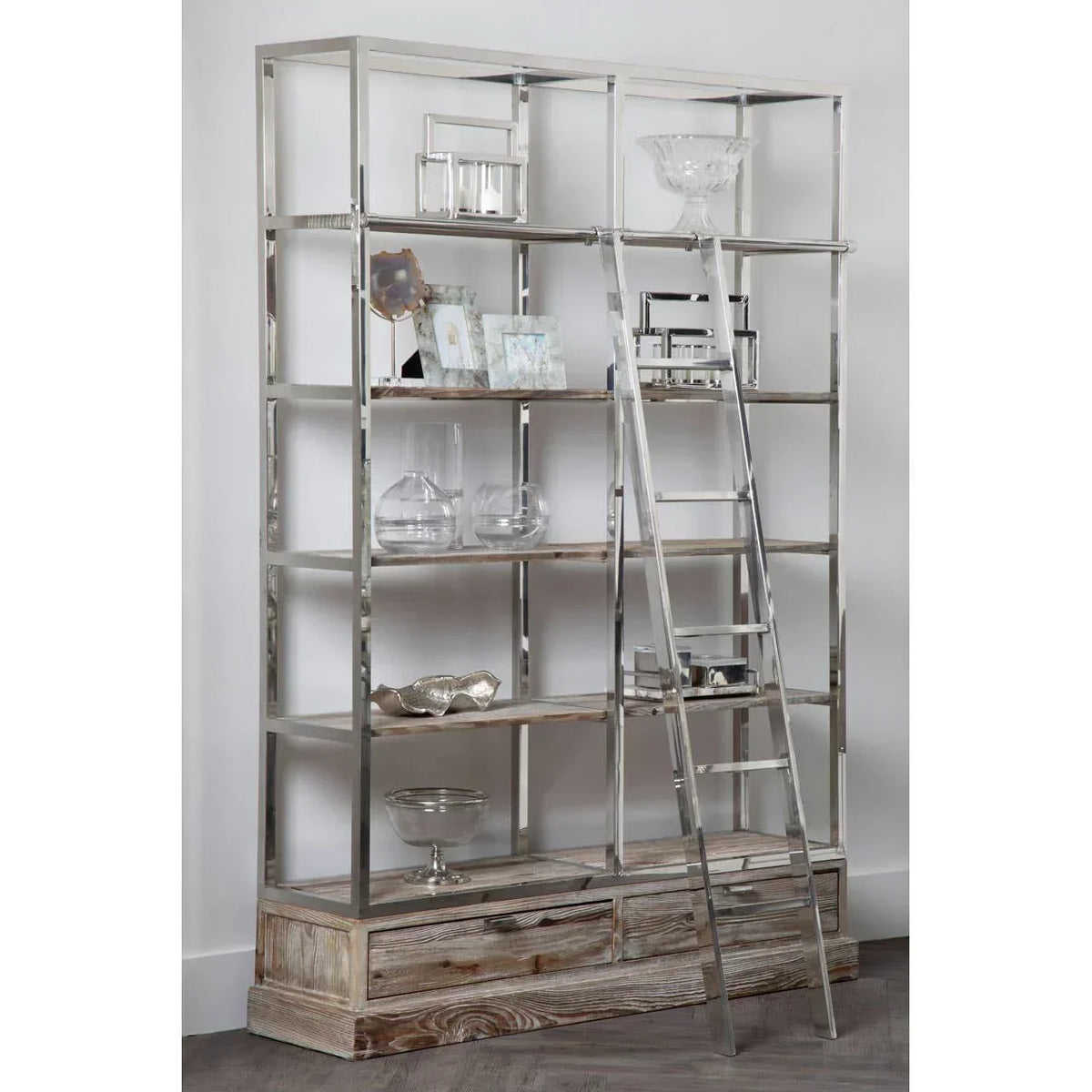 Metal and wood display shelving unit with ladder, glass ornaments, and decor accessories
