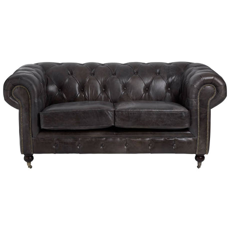 Dark grey brown leather Chesterfield 2 seat sofa featuring a tufted backrest, rolled arms, and wooden legs. The sofa has a classic design with a polished finish, suitable for a stylish living room setting