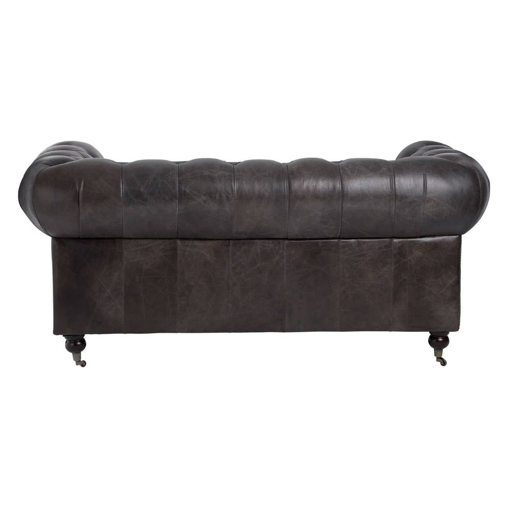 Dark grey brown leather Chesterfield 2 seat sofa featuring a tufted backrest, rolled arms, and wooden legs. The sofa has a classic design with a smooth leather finish and a low profile