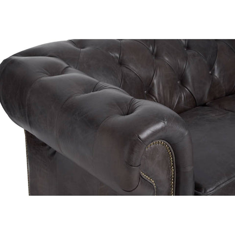 Dark grey brown leather Chesterfield 2 seat sofa featuring a tufted design on the backrest and armrests, with a rounded arm and a sleek, modern silhouette. The leather has a slightly distressed finish, adding character to the piece