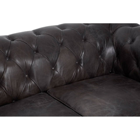 Dark grey brown leather Chesterfield 2 seat sofa featuring a tufted backrest and seat cushions, showcasing a classic design with elegant stitching and a smooth finish