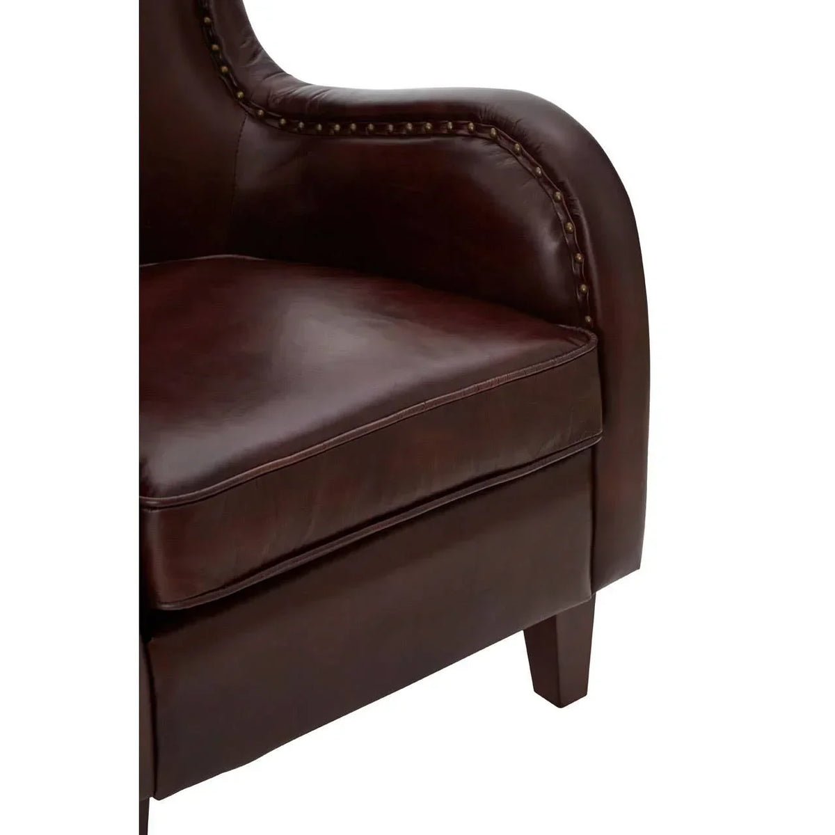 Brown leather armchair with nailhead trim and curved armrest detail