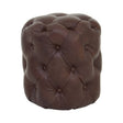 Brown leather stool featuring a button-tufted design with a rounded shape and a soft, textured surface. The stool has a rich, dark brown color and is accented with visible stitching and buttons, providing a classic and elegant look suitable for various home decor styles