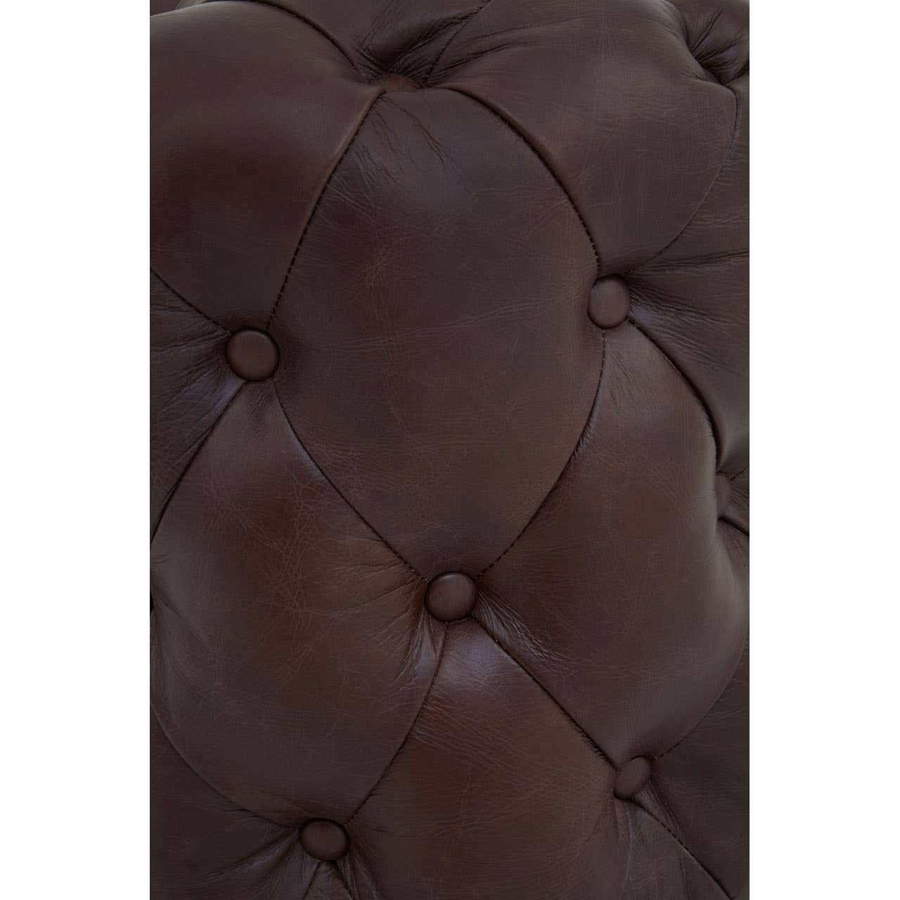 Close-up view of a brown leather stool featuring button tufting and a smooth, glossy finish, highlighting the intricate stitching and plush texture of the upholstery