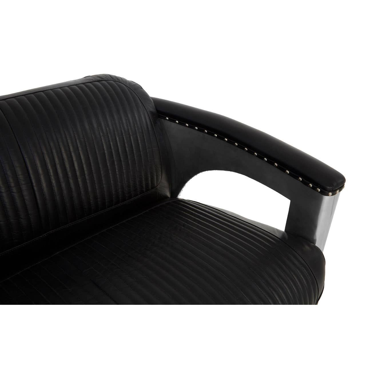 Close-up view of the armrest of a black leather sofa featuring a sleek design with ribbed texture and a cut-out detail for added style