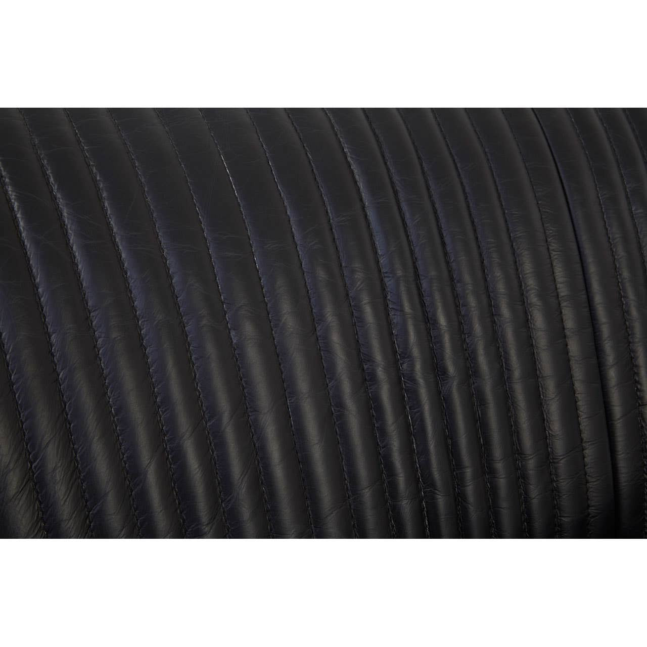 Close-up view of the textured black leather upholstery on the Victor 2 Seat Sofa, showcasing the subtle ribbed pattern and smooth finish
