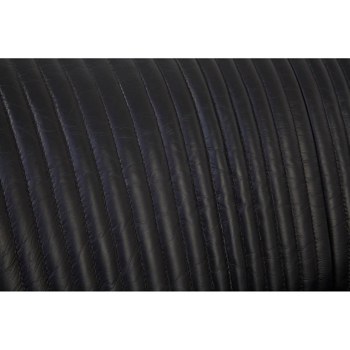 Close-up view of the textured black leather upholstery on the Victor 2 Seat Sofa, showcasing the subtle ribbed pattern and smooth finish