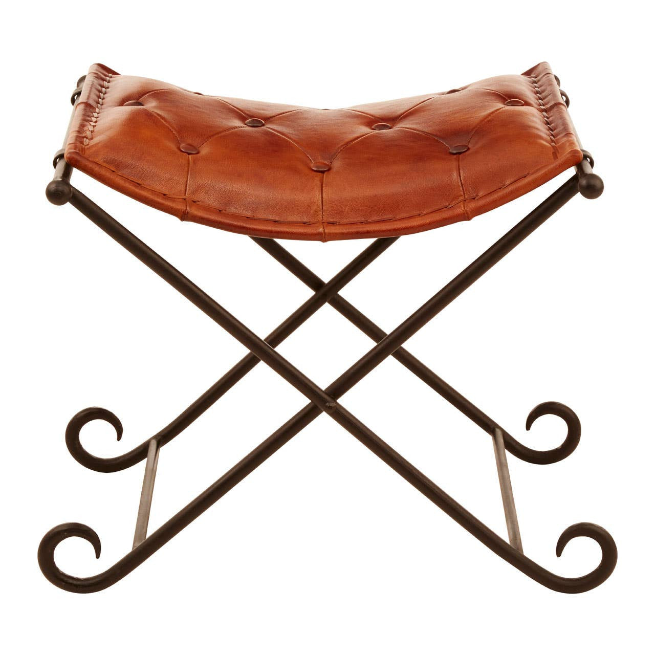 Buffalo tan leather folding stool with a curved seat and an iron frame featuring an elegant cross design and scroll accents on the legs