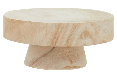 Small wooden riser with a round top and a tapered base, featuring a light natural wood finish and subtle grain patterns