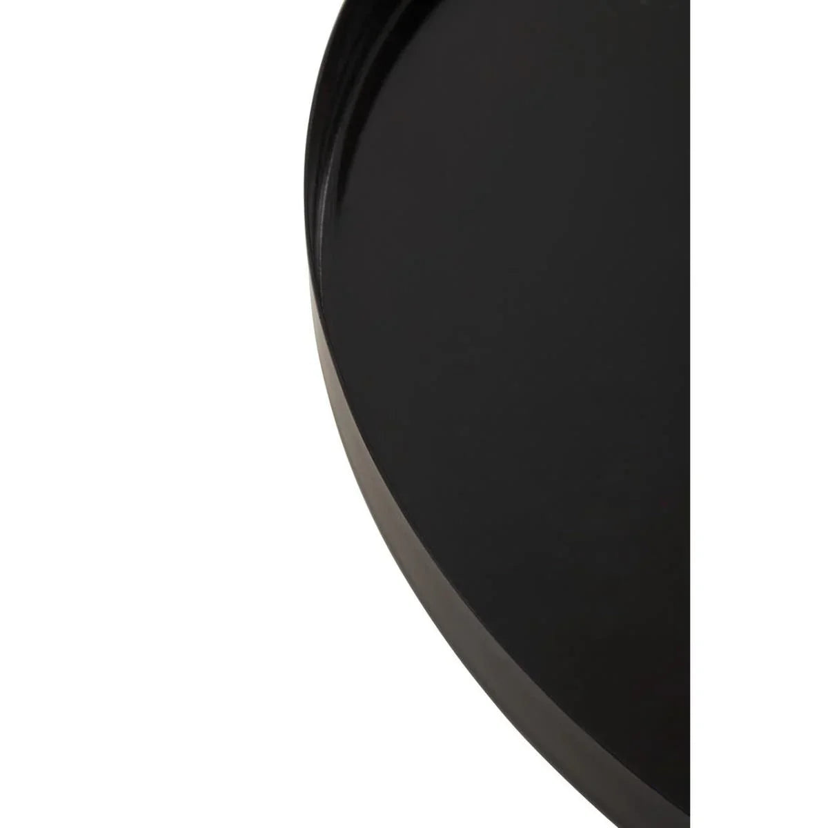 Close-up of black metal round tray table top with smooth glossy finish