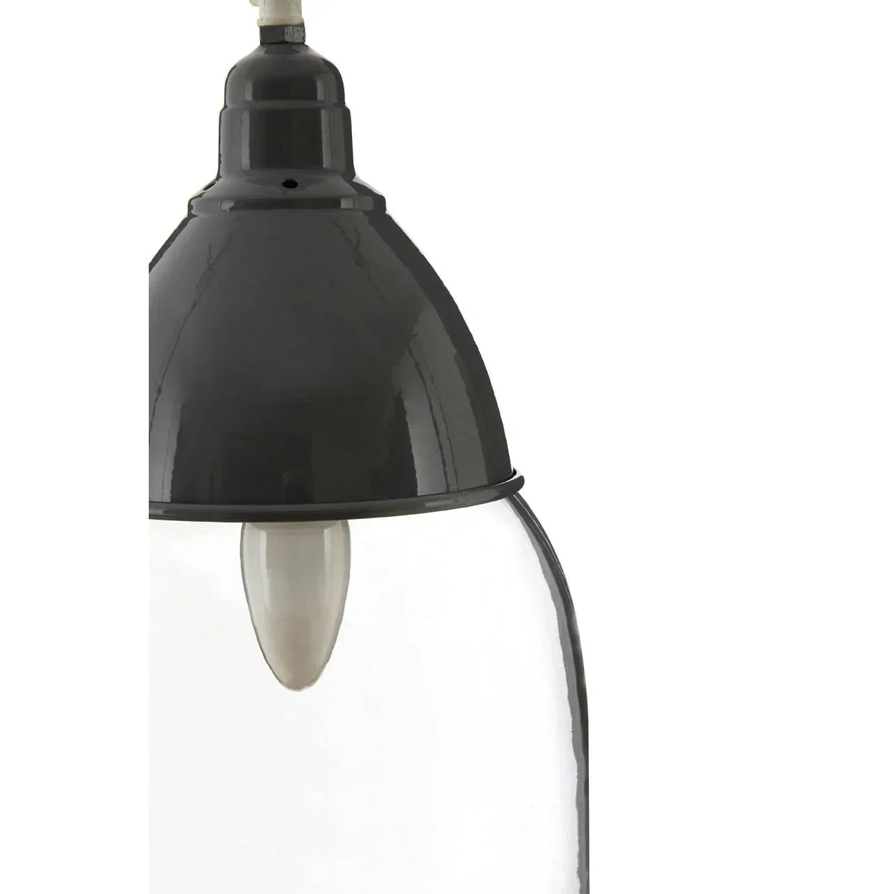 Black metal pendant light with clear glass shade, close view of bulb and fixture detail