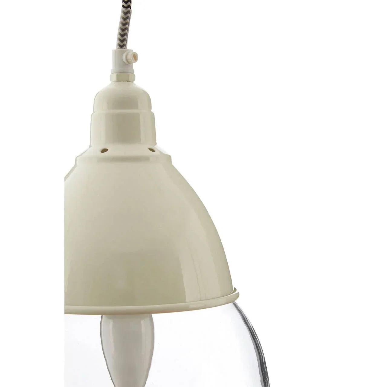 Cream metal pendant light with glass shade and zigzag cord, close-up view