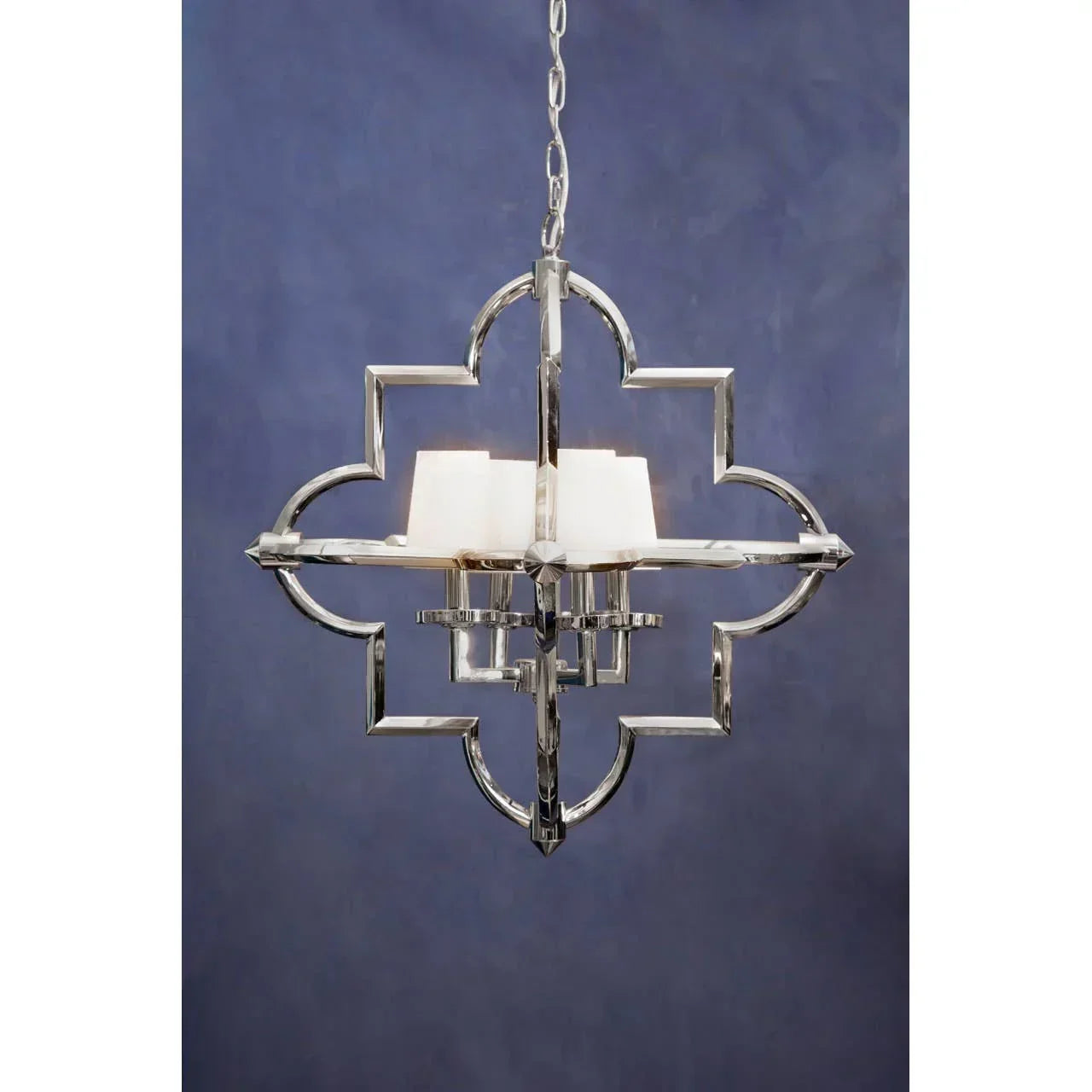 Chrome pendant light with geometric frame and four white glass shades against dark blue wall