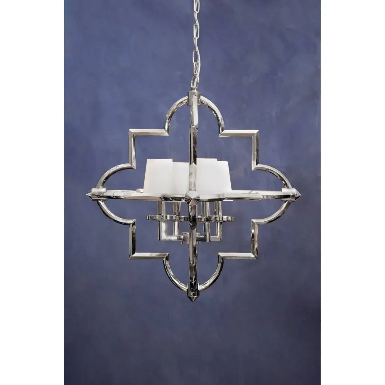 Chrome pendant light with quatrefoil frame and white candle-style bulbs, front view