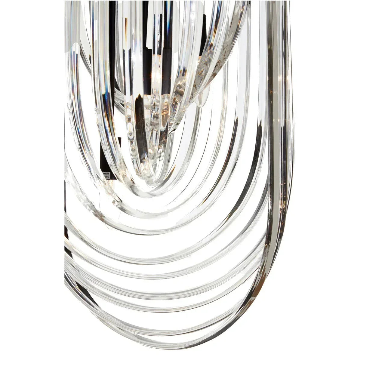 Clear glass chandelier tubes in curved layers, close up on modern lighting details
