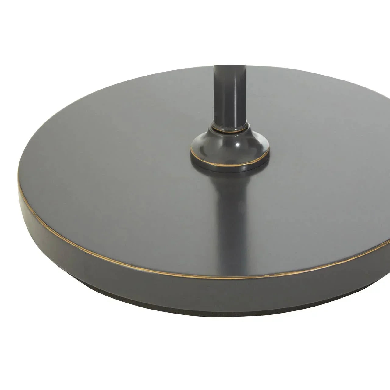 Round metal table base in matte black with gold trim detail, close-up view