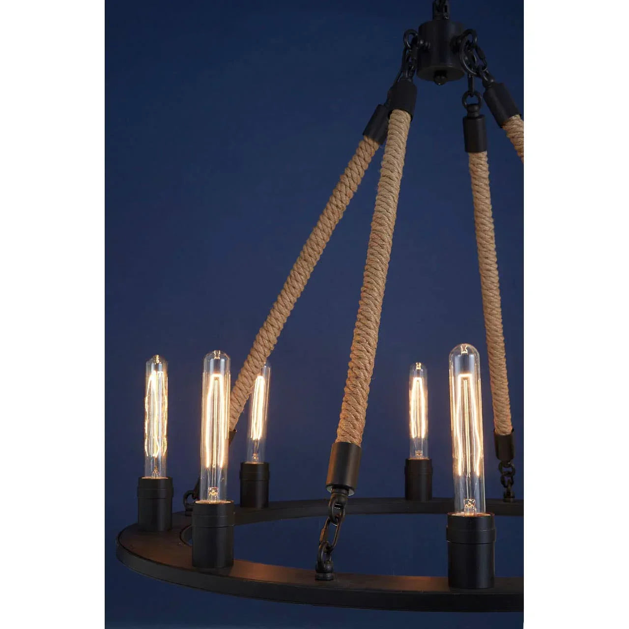 Industrial chandelier with exposed filament bulbs and rope suspension against blue background