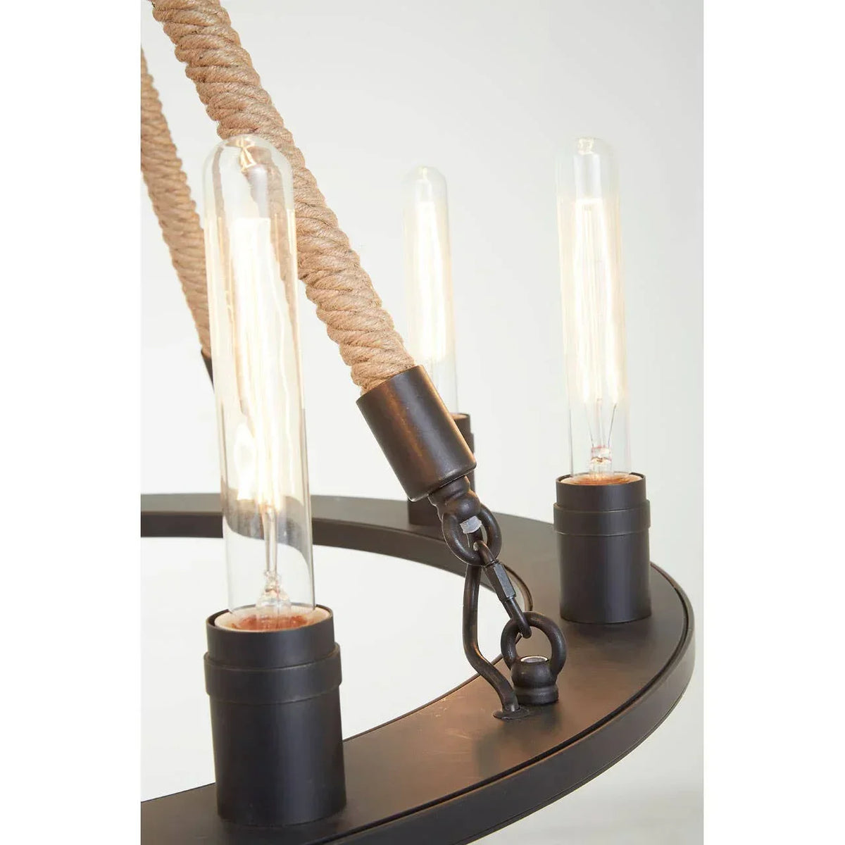 Industrial chandelier with rope suspension and exposed filament bulbs on metal frame