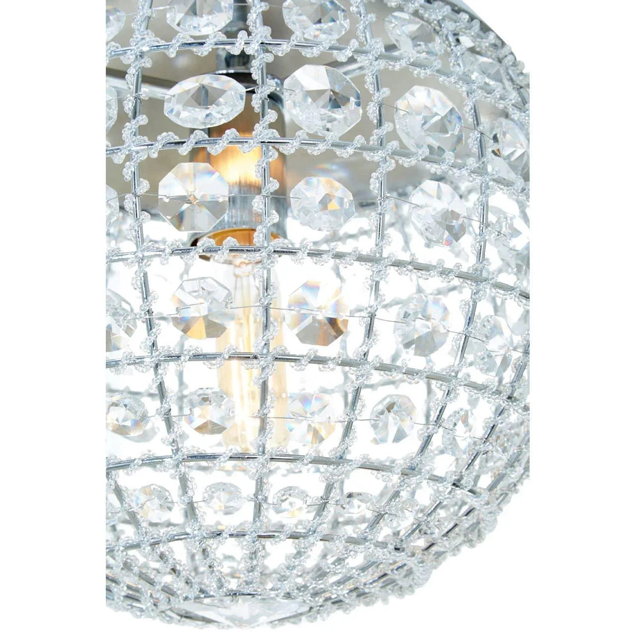 Close-up of crystal chandelier light with faceted glass and metal grid pattern