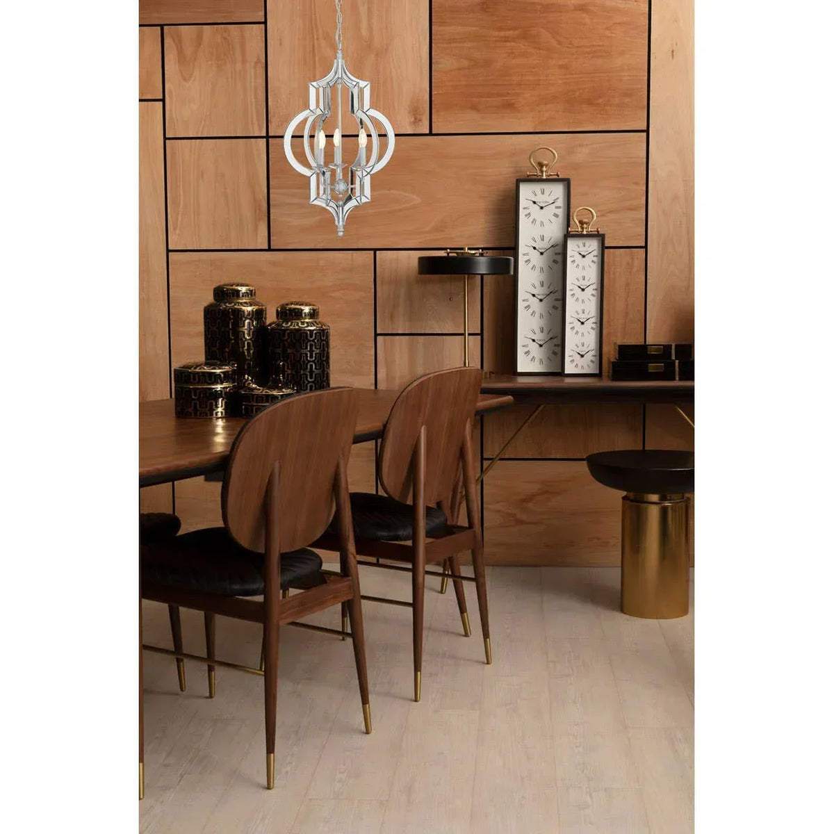 Modern dining room set with wooden chairs, gold accents and decorative jars on wooden floor