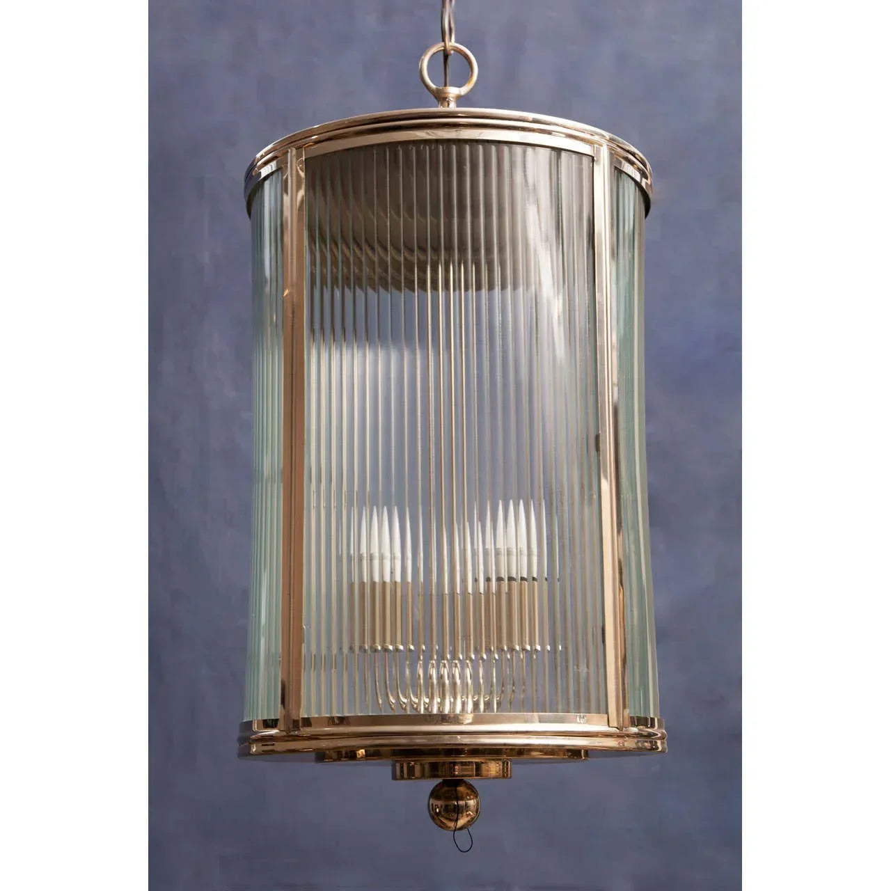Brass and glass pendant light with vertical ribbed panels and gold frame