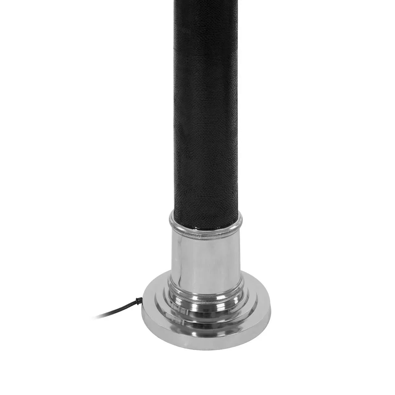 Black floor lamp base with chrome finish and power cord detail