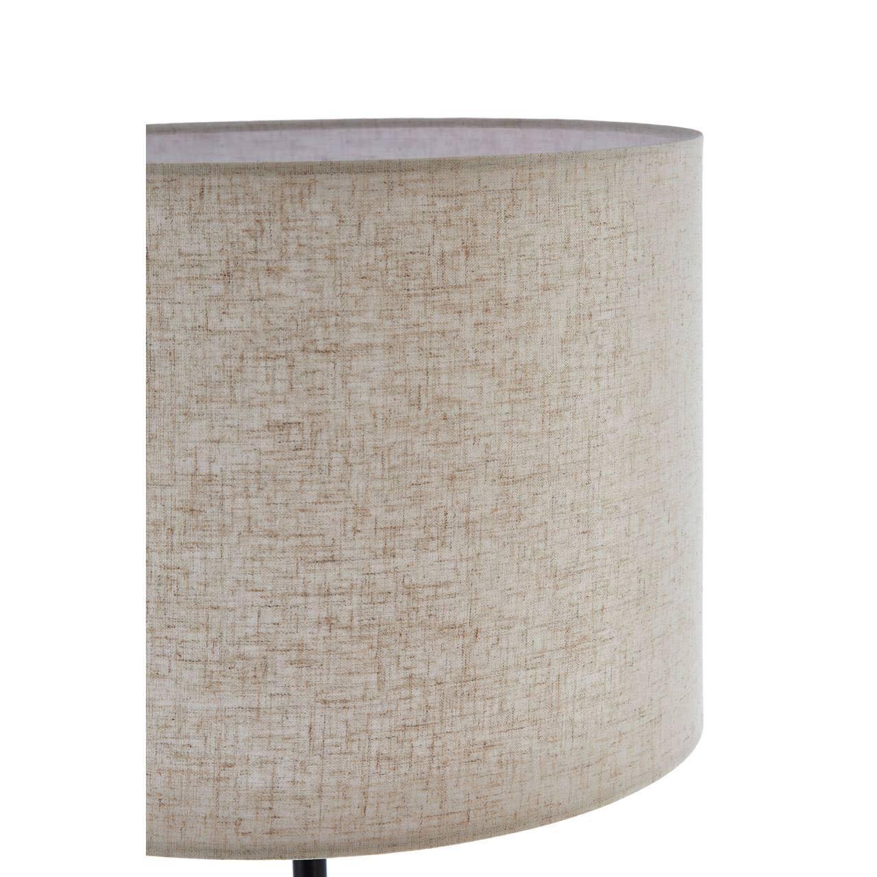 Closeup of fabric drum lampshade in beige with subtle textured pattern