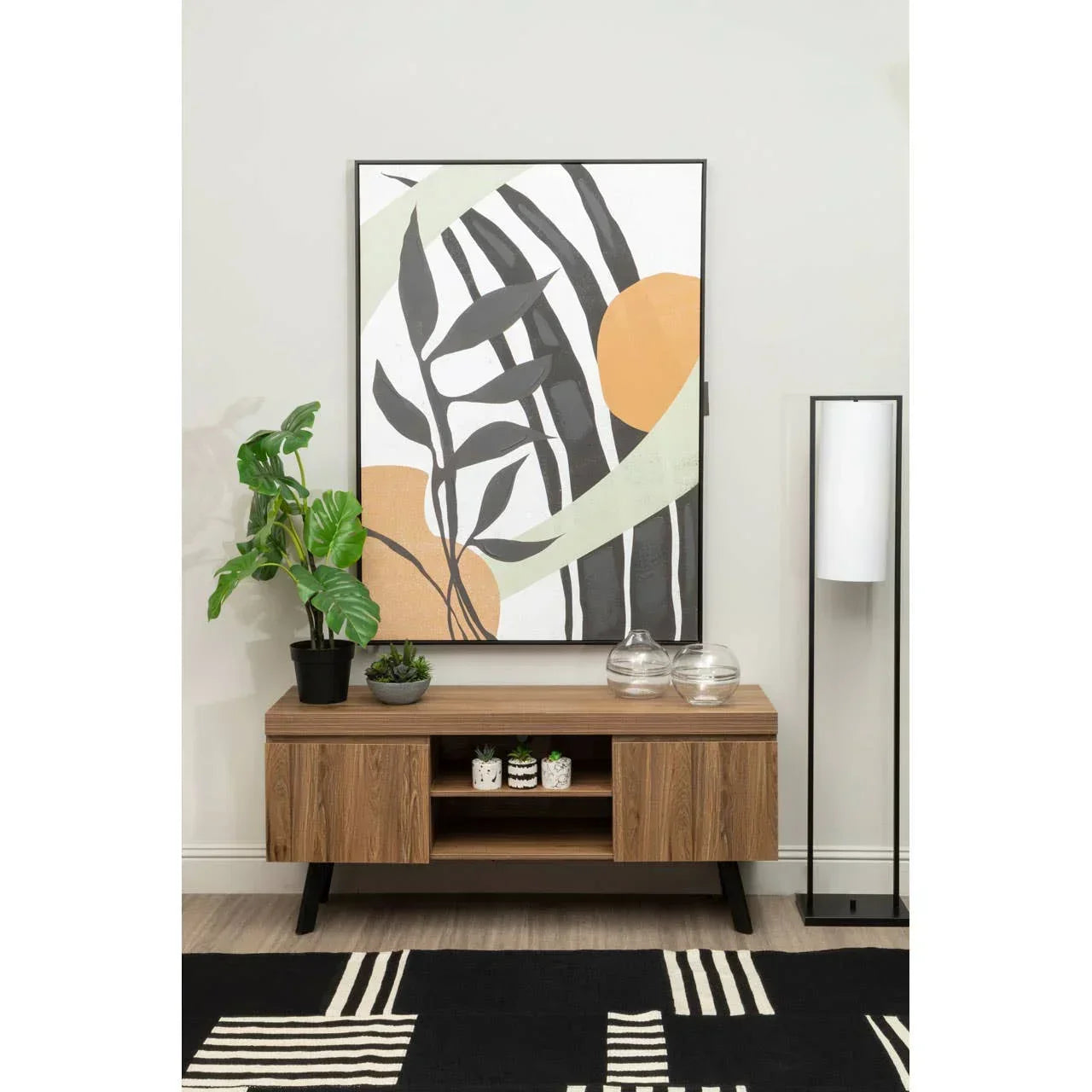 Walnut effect TV unit with plants, vases, and abstract wall art in modern living room