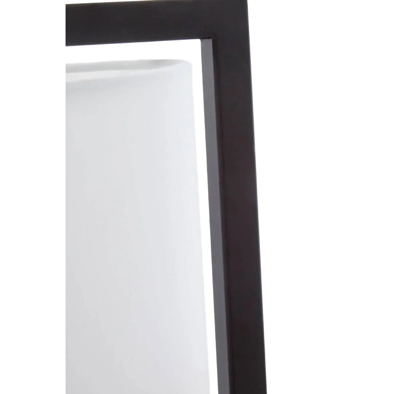 Close view of black metal mirror frame with reflective glass corner