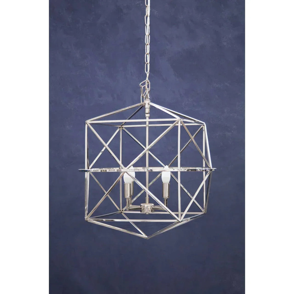 Chrome geometric pendant light fixture with exposed bulbs and chain against blue wall