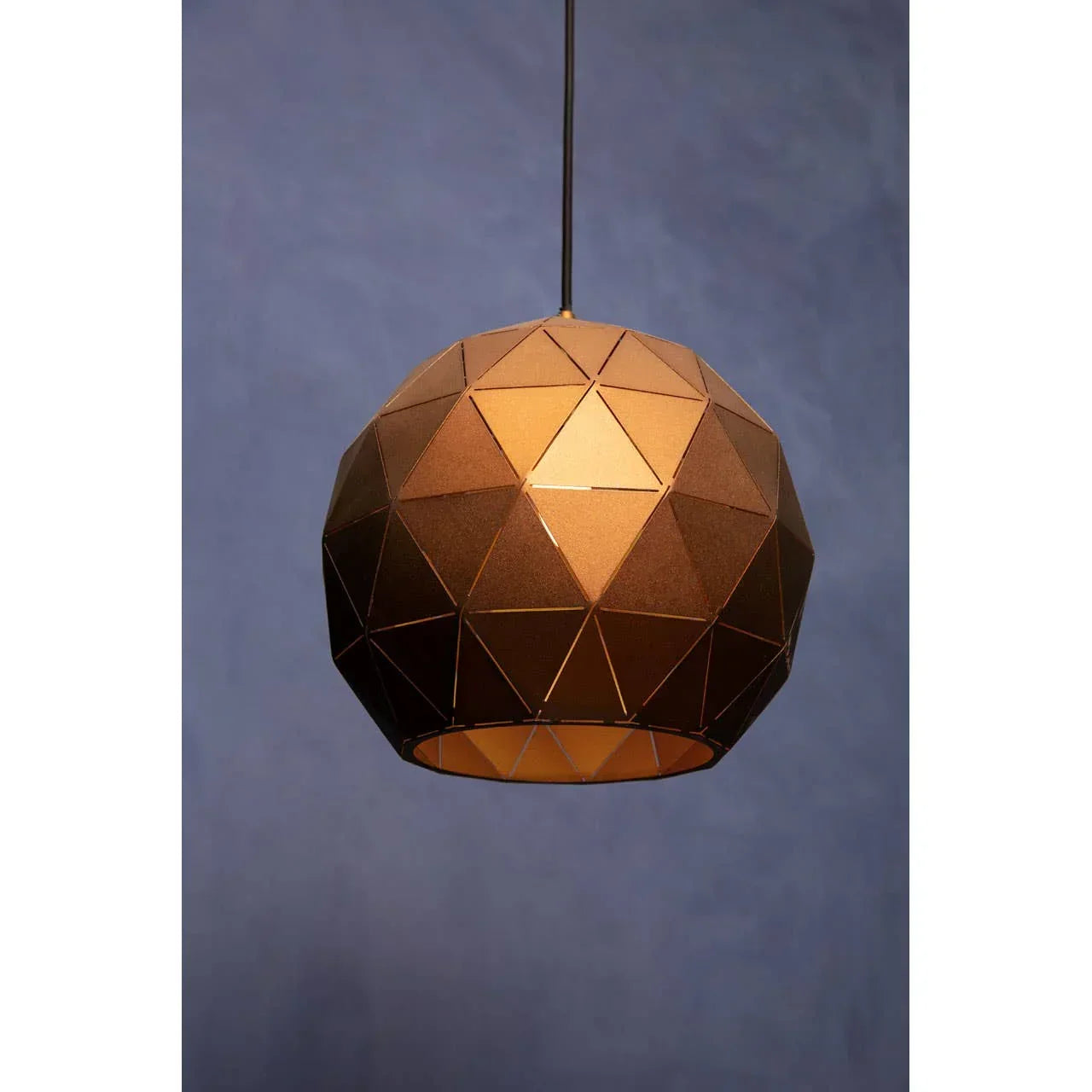 Geometric brown pendant light shade with faceted design and warm glow against blue background