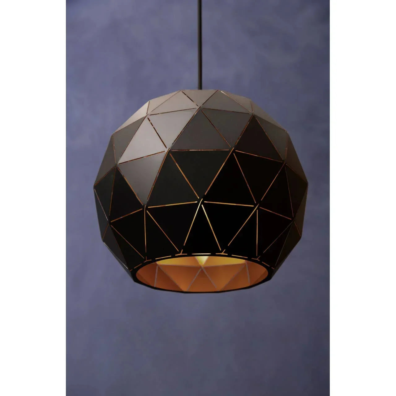 Black geometric pendant light shade with gold interior against blue background