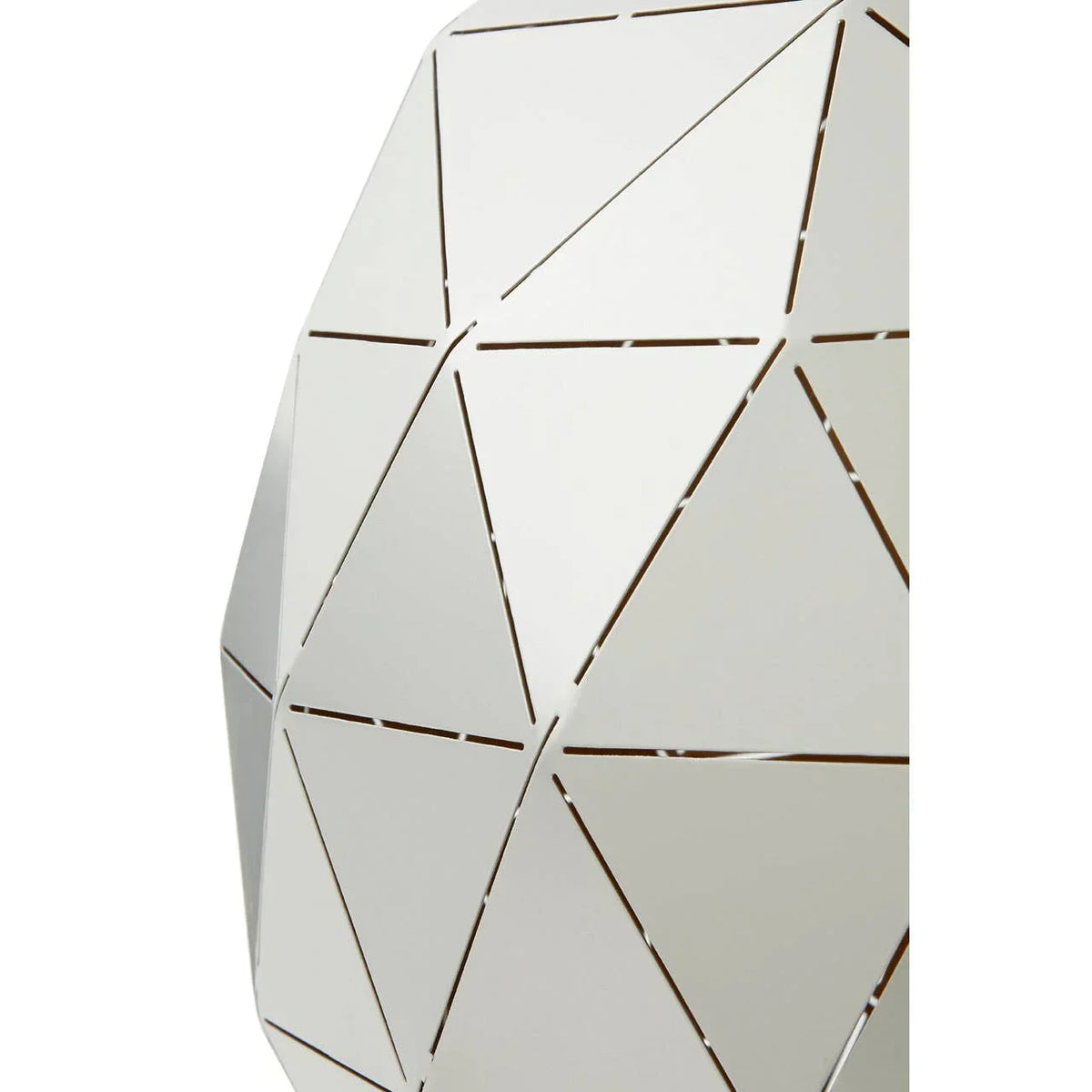 White geometric metal lampshade with triangular cutout pattern close-up