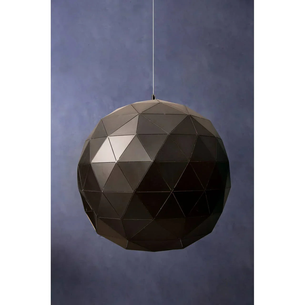Black geometric pendant light with faceted panels and matte finish against blue background