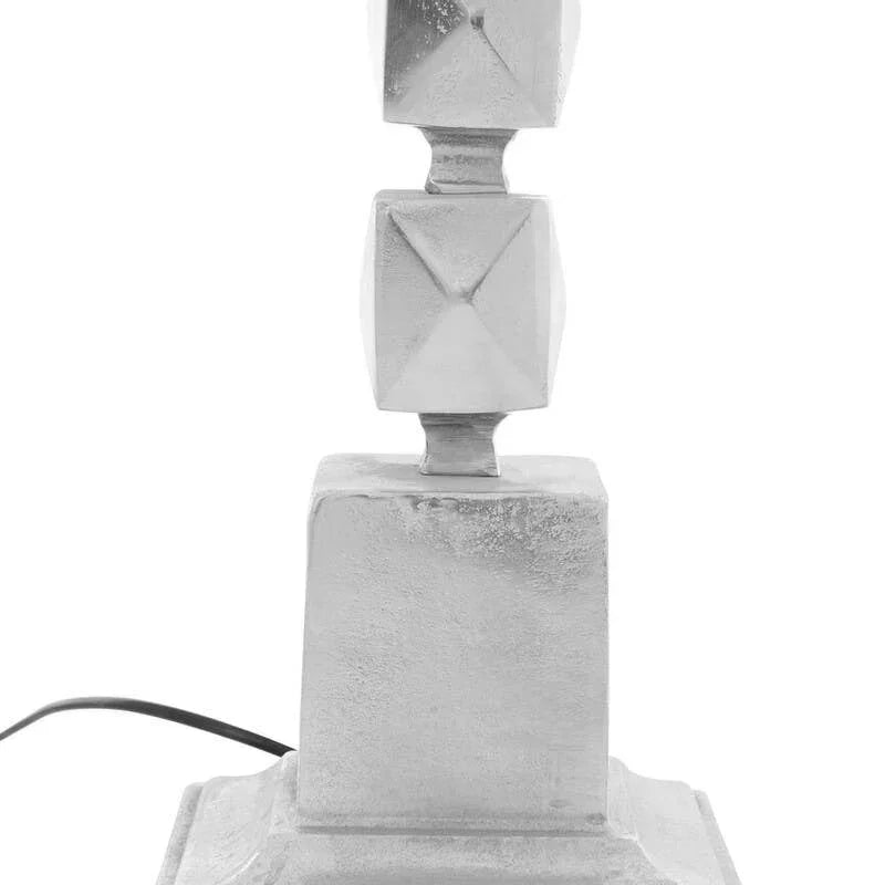 Silver table lamp base with geometric square pattern and visible black power cord