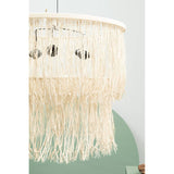 Natural rattan ceiling light with fringe detail and circular frame against pale wall