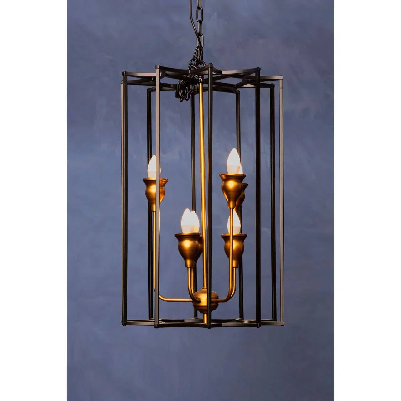 Gold and black metal pendant light with four candle-style bulbs in geometric frame